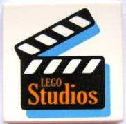 3068px6 - Tile 2 x 2 with Orange 'LEGO Studios' on Black Film Slate Pattern