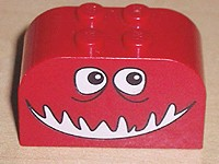 4744pb09 - Slope, Curved 4 x 2 x 2 Double with 4 Studs with Monster Face with Black and White Eyes, Open Mouth Smile Pattern