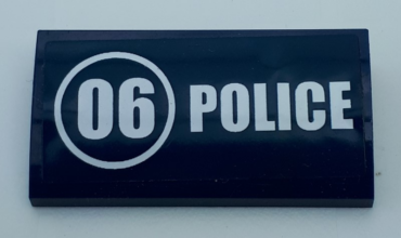 88930pb122 - Slope, Curved 2 x 4 x 2/3 with Bottom Tubes with White '06' in Circle and 'POLICE' Pattern (Sticker) - Set 60071