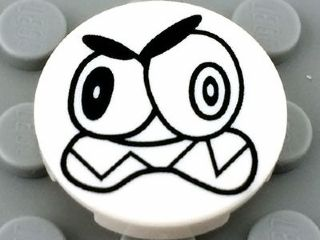14769pb006 - Tile, Round 2 x 2 with Bottom Stud Holder with Black Large Eyes and Scowl with Sharp Teeth (Nixel Face) Pattern