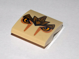 15068pb002 - Slope, Curved 2 x 2 x 2/3 with Lion Armor and Eyes Pattern